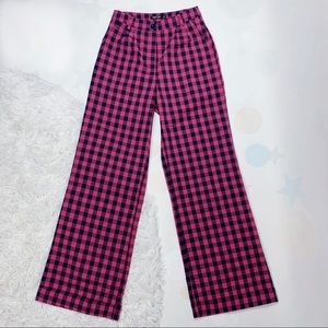 High-waisted pink and black gingham plaid trousers